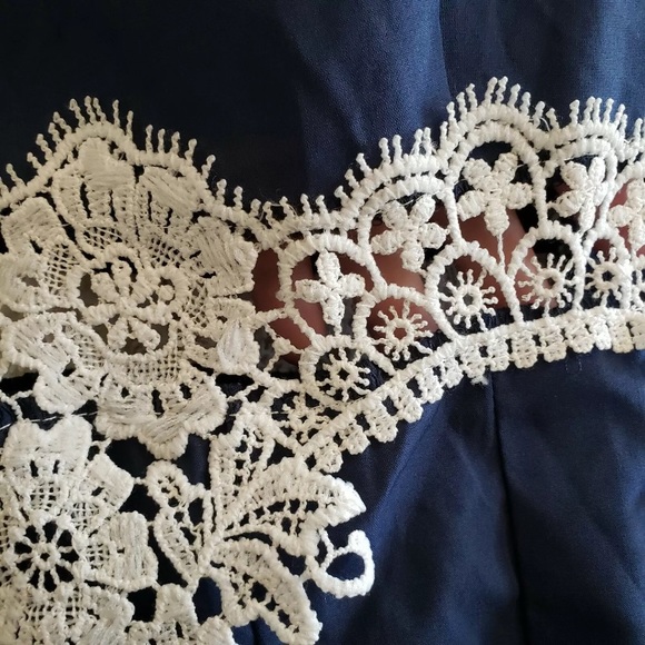 Navy romper with open sides and lace midriff - Picture 4 of 6